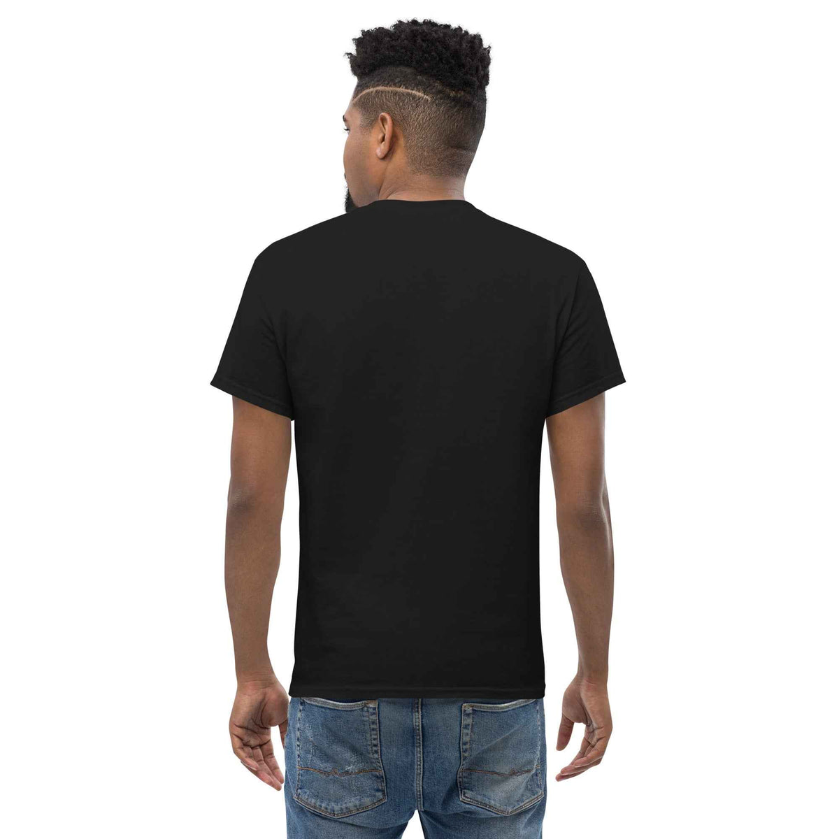 Black unisex classic tee: straight back view on a male model, styled and paired with blue jeans against a studio backdrop