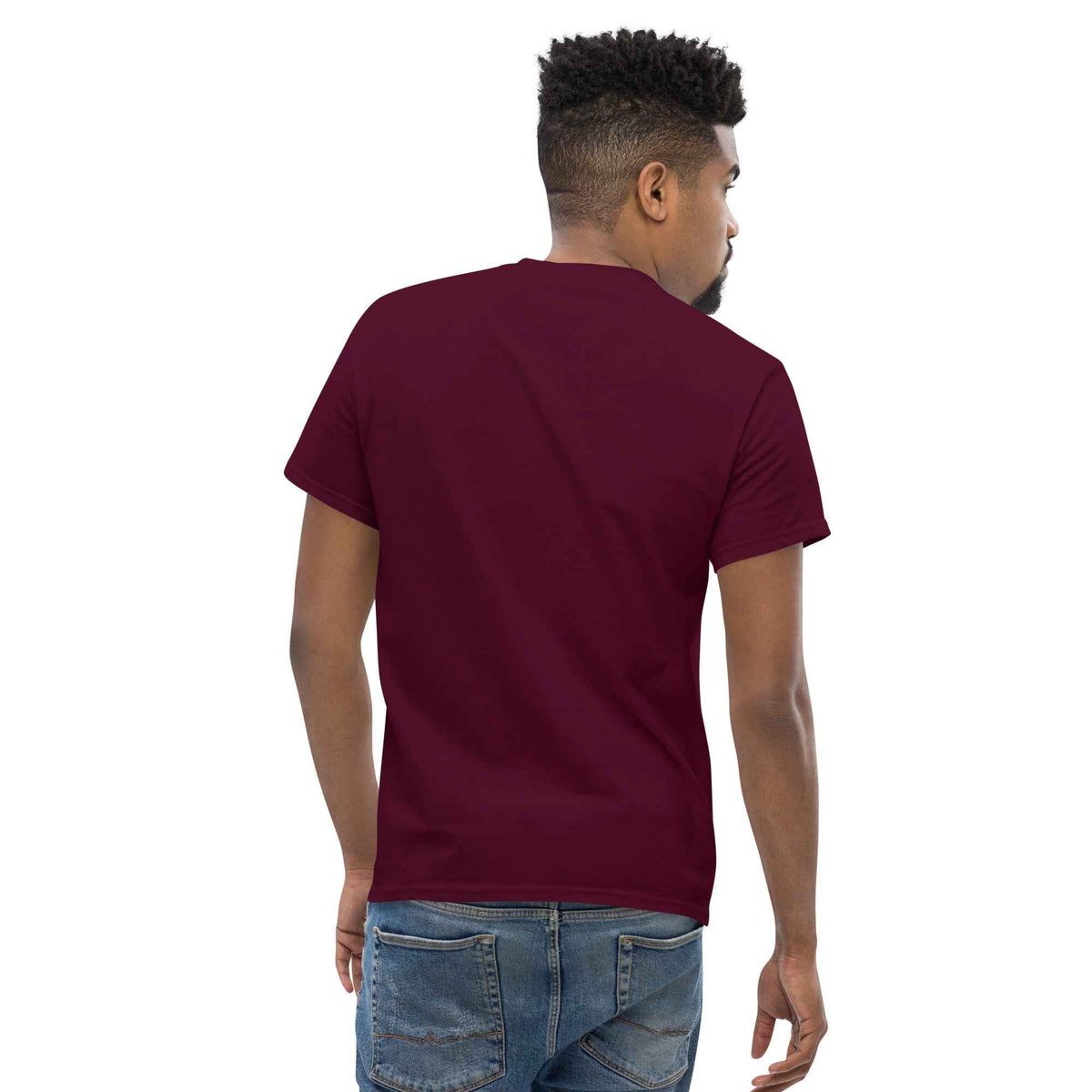 Maroon unisex classic tee: back three-quarter angle view on male model, paired with blue jeans against studio background