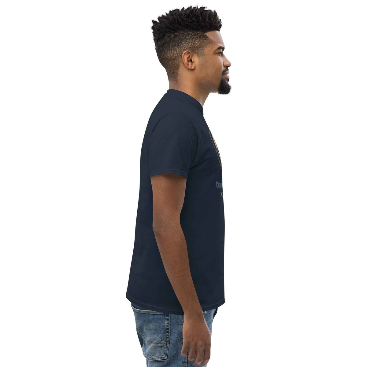 Navy blue unisex classic tee having Cranston's Bean & Mariner Coffee design logo; profile view facing right on a male model