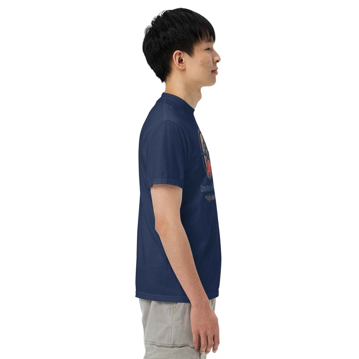 Unisex Garment-Dyed Heavyweight black T-shirt by Cranston Bean Mariner, displaying on a side view model profile looking right