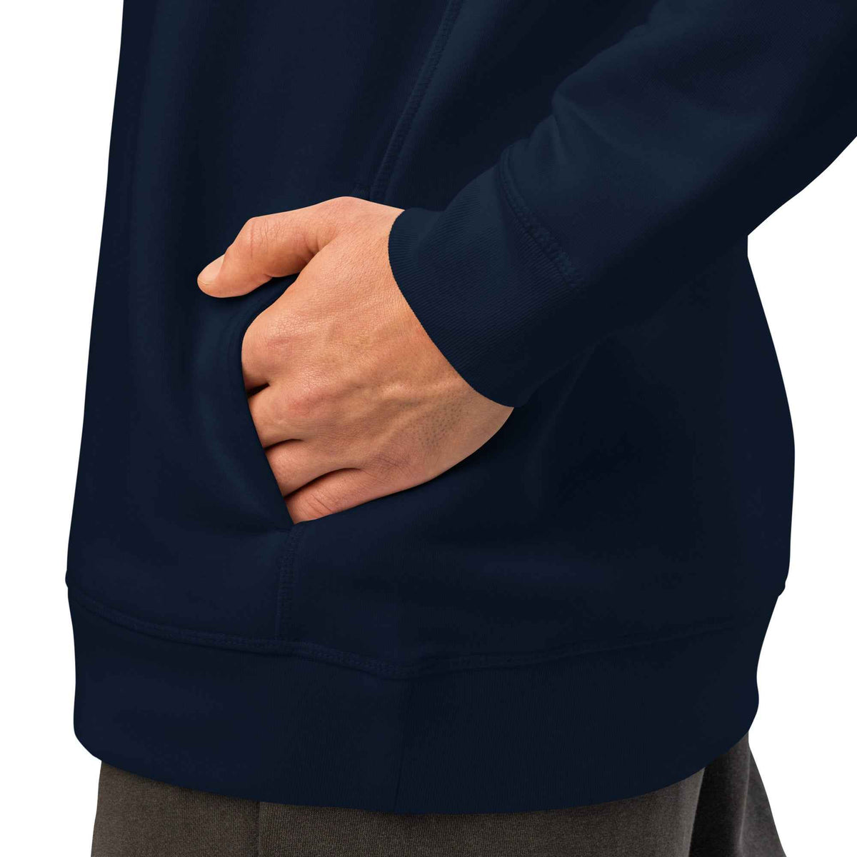 Unisex Organic Side Pocket Hoodie by Cranston Bean Mariner, showing side view of a model having hands fingers in pockets
